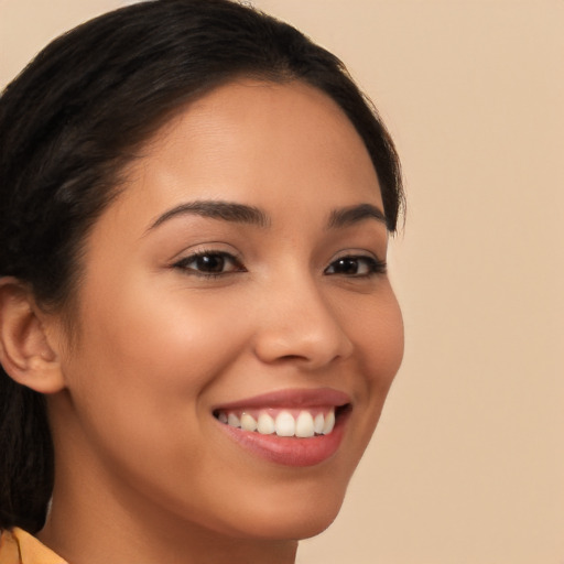 Joyful latino young-adult female with long  brown hair and brown eyes