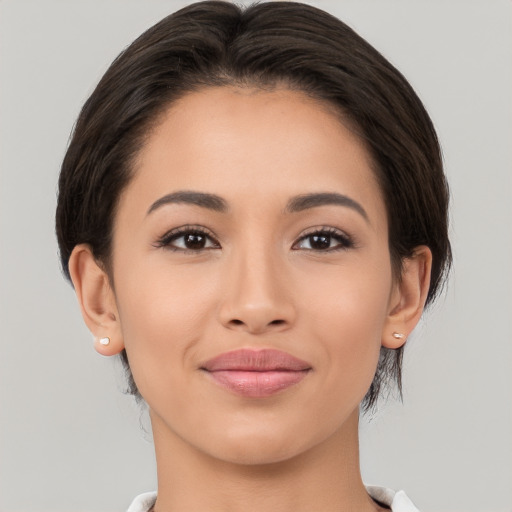 Joyful white young-adult female with medium  brown hair and brown eyes