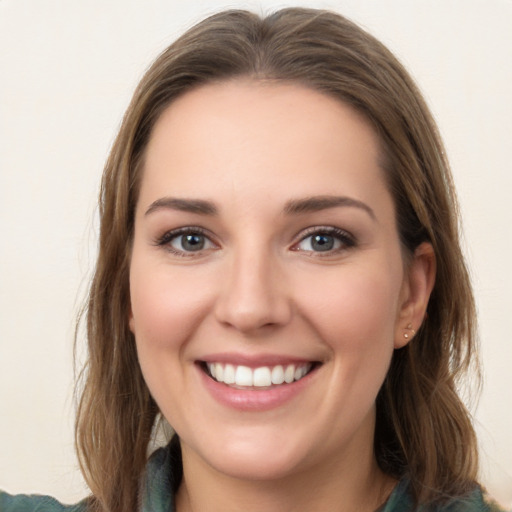 Joyful white young-adult female with long  brown hair and grey eyes