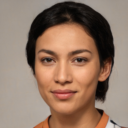 Joyful latino young-adult female with medium  black hair and brown eyes