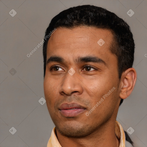 Joyful latino young-adult male with short  black hair and brown eyes