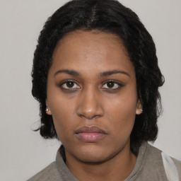 Neutral black young-adult female with short  black hair and brown eyes