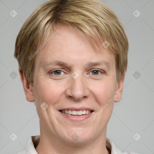 Joyful white adult female with short  brown hair and grey eyes