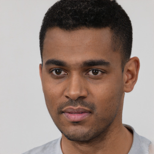 Neutral black young-adult male with short  black hair and brown eyes