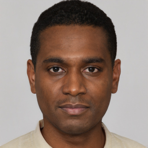 Neutral black young-adult male with short  black hair and brown eyes