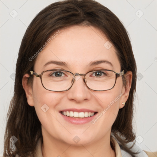 Joyful white adult female with medium  brown hair and blue eyes