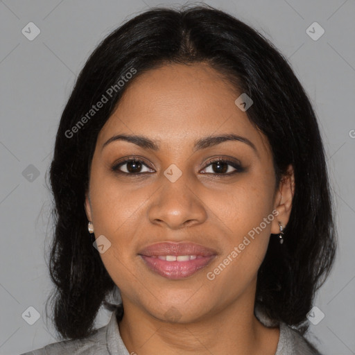 Joyful black young-adult female with medium  black hair and brown eyes