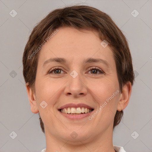 Joyful white adult female with short  brown hair and brown eyes