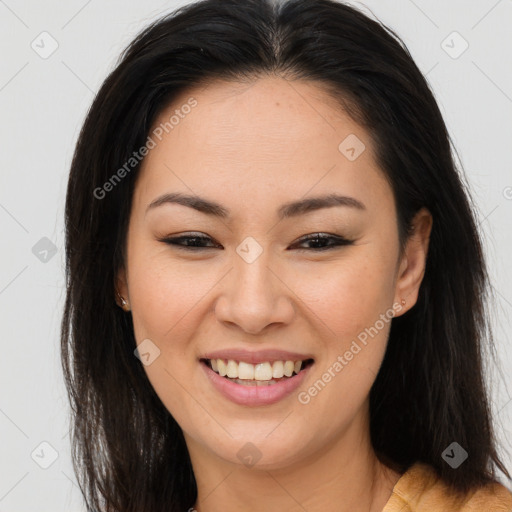 Joyful asian young-adult female with long  brown hair and brown eyes