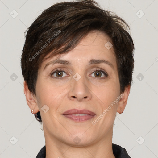 Joyful white adult female with short  brown hair and brown eyes