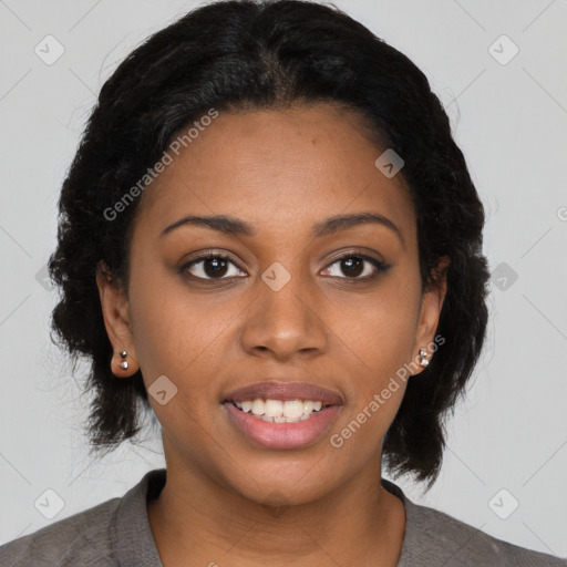 Joyful black young-adult female with long  black hair and brown eyes