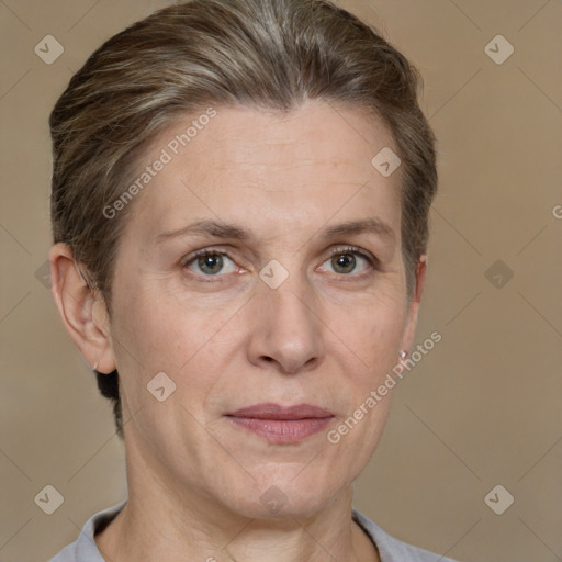 Joyful white adult female with short  brown hair and grey eyes