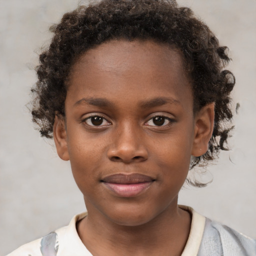 Joyful black child female with short  brown hair and brown eyes