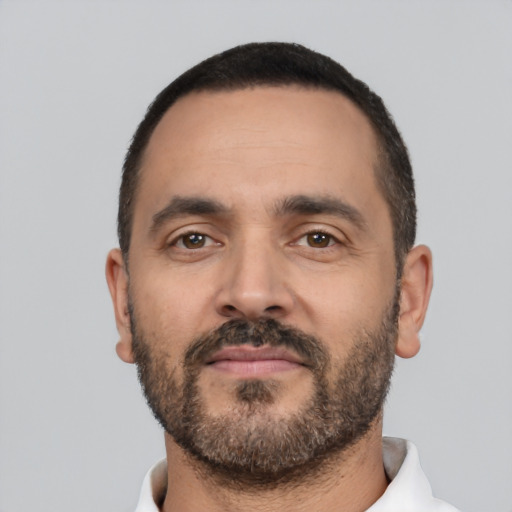 Neutral latino adult male with short  black hair and brown eyes