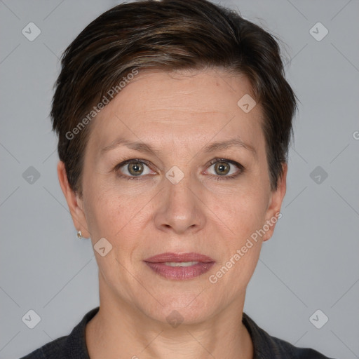 Joyful white adult female with short  brown hair and grey eyes