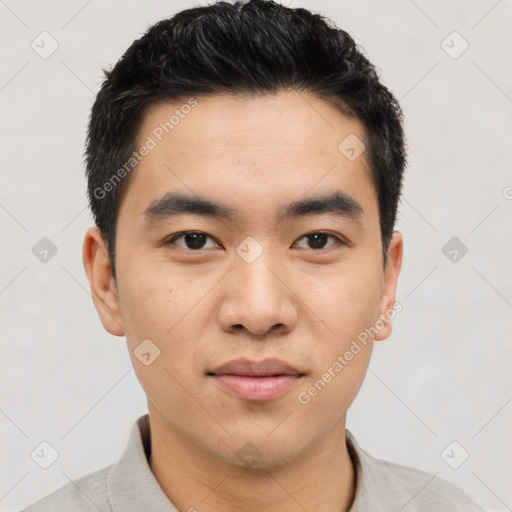 Joyful asian young-adult male with short  black hair and brown eyes