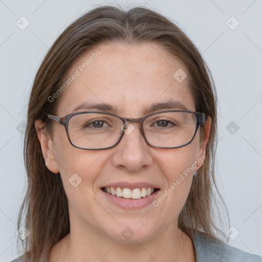 Joyful white adult female with medium  brown hair and grey eyes