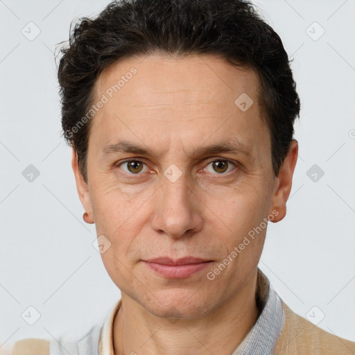 Joyful white adult male with short  brown hair and brown eyes