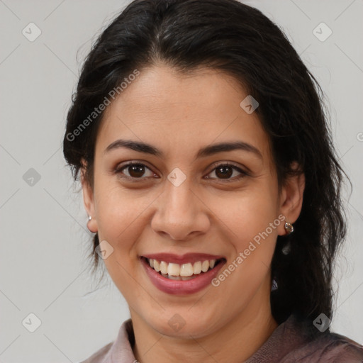 Joyful latino young-adult female with medium  brown hair and brown eyes