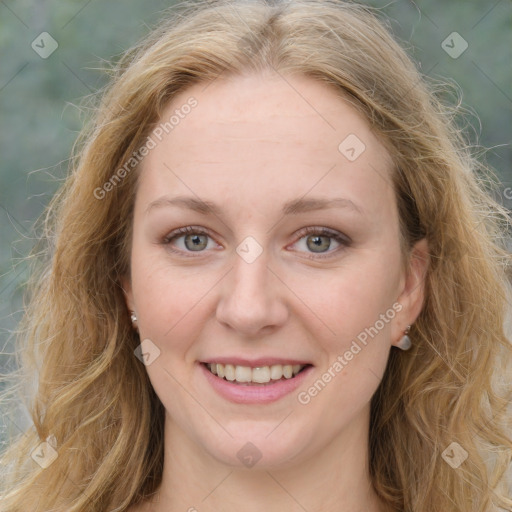 Joyful white young-adult female with long  brown hair and blue eyes