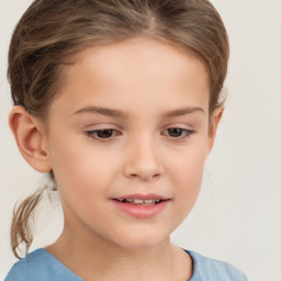 Joyful white child female with short  brown hair and brown eyes