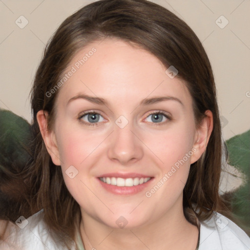 Joyful white young-adult female with medium  brown hair and green eyes