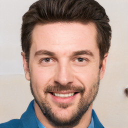 Joyful white adult male with short  brown hair and brown eyes