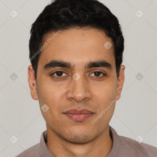 Joyful latino young-adult male with short  black hair and brown eyes