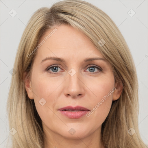 Joyful white adult female with long  brown hair and brown eyes