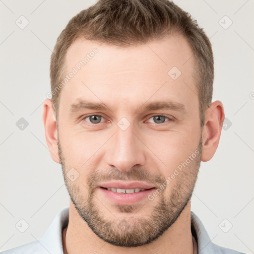 Joyful white young-adult male with short  brown hair and grey eyes