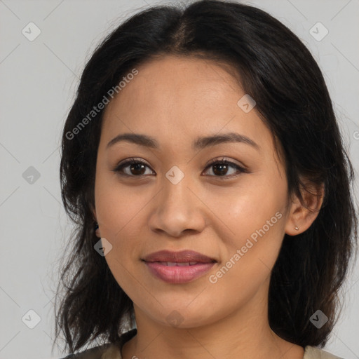 Joyful latino young-adult female with medium  brown hair and brown eyes