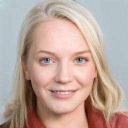 Joyful white young-adult female with medium  brown hair and blue eyes