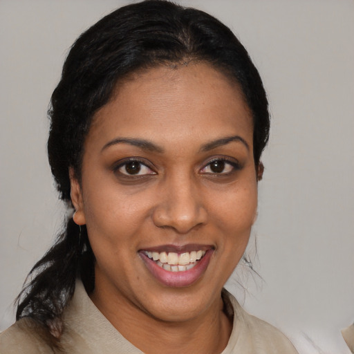 Joyful latino young-adult female with short  brown hair and brown eyes