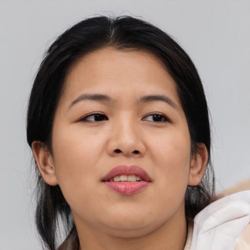 Joyful asian young-adult female with medium  brown hair and brown eyes