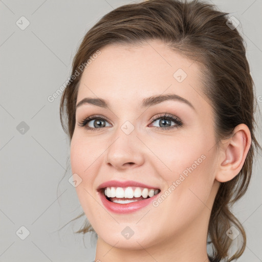 Joyful white young-adult female with medium  brown hair and blue eyes