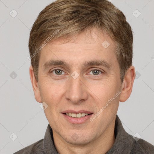 Joyful white adult male with short  brown hair and grey eyes