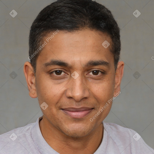 Joyful black young-adult male with short  brown hair and brown eyes