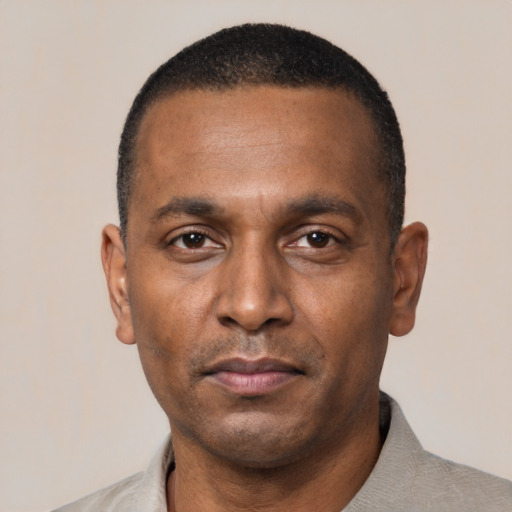 Neutral black adult male with short  black hair and brown eyes