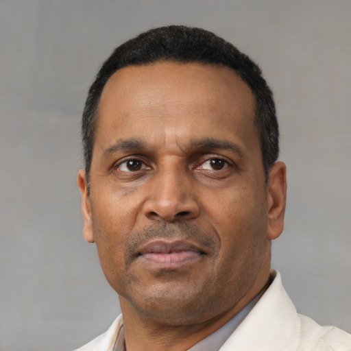Neutral black adult male with short  black hair and brown eyes