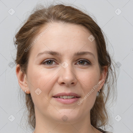 Joyful white adult female with medium  brown hair and brown eyes