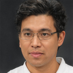 Neutral asian adult male with short  black hair and brown eyes