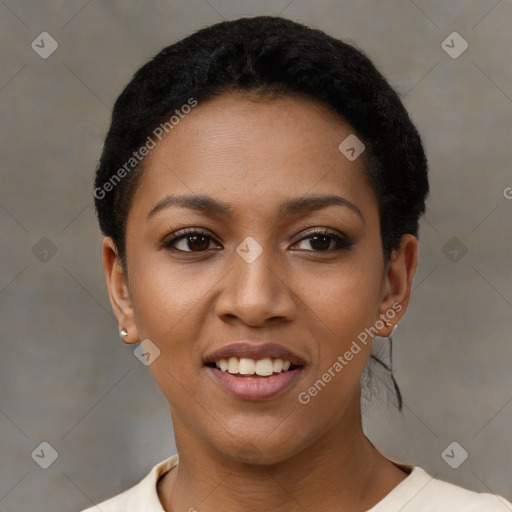 Joyful black young-adult female with short  black hair and brown eyes