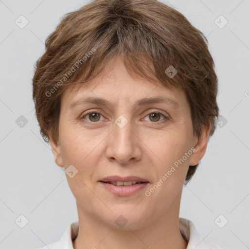 Joyful white adult female with short  brown hair and grey eyes