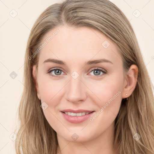 Joyful white young-adult female with long  brown hair and blue eyes