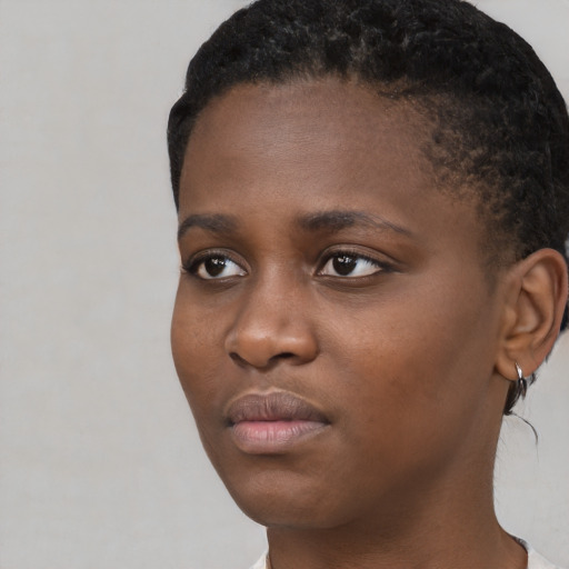 Neutral black young-adult female with short  black hair and brown eyes
