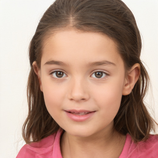 Joyful white child female with medium  brown hair and brown eyes