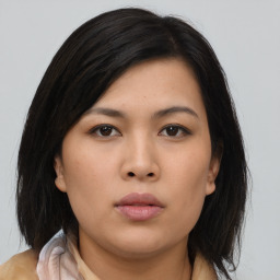 Neutral asian young-adult female with medium  brown hair and brown eyes