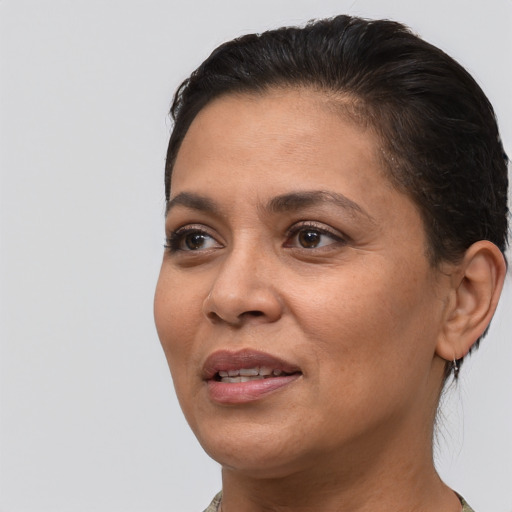 Joyful white adult female with short  brown hair and brown eyes