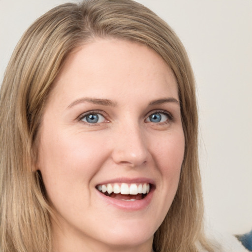 Joyful white young-adult female with long  brown hair and grey eyes