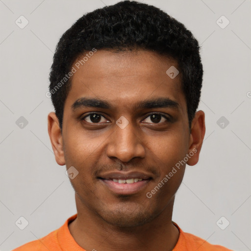 Joyful black young-adult male with short  black hair and brown eyes